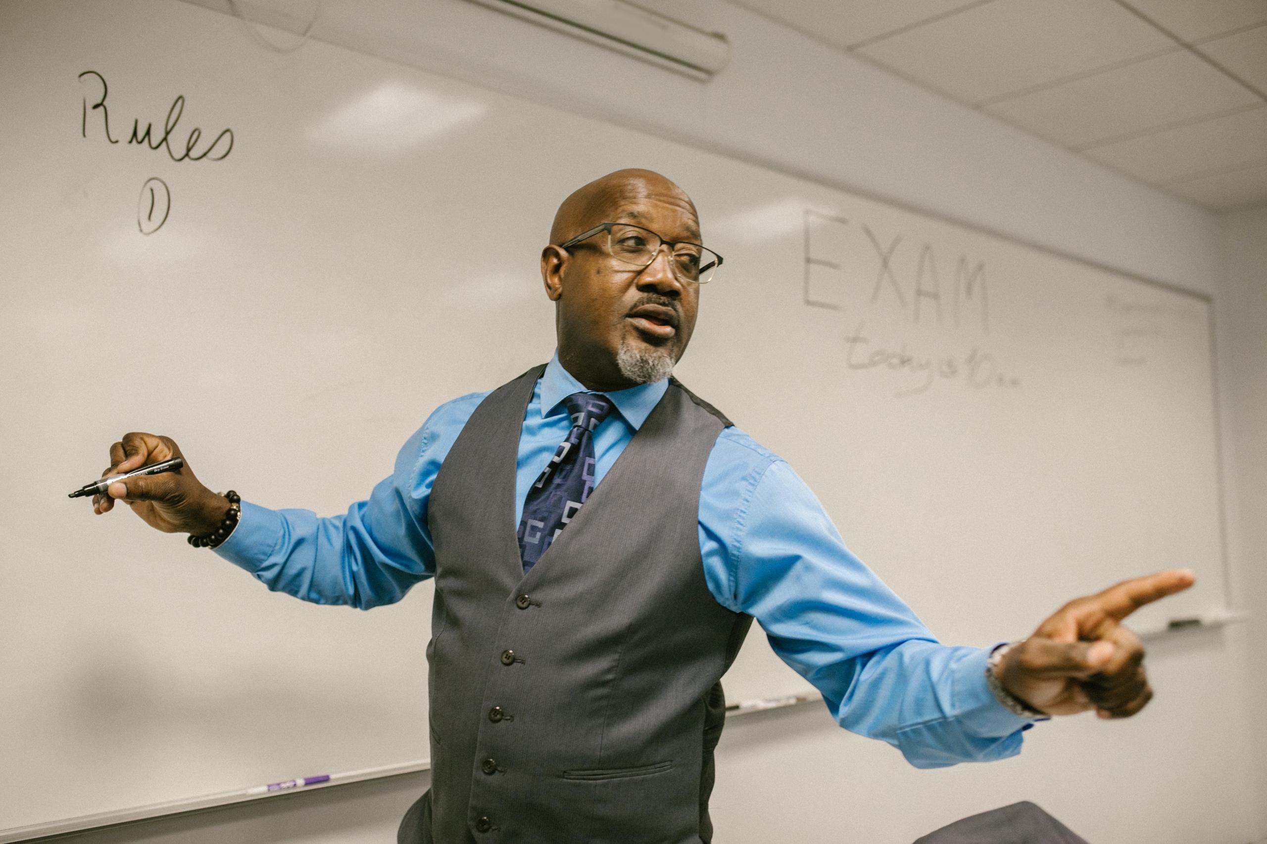 Black teacher teaching CXC classes